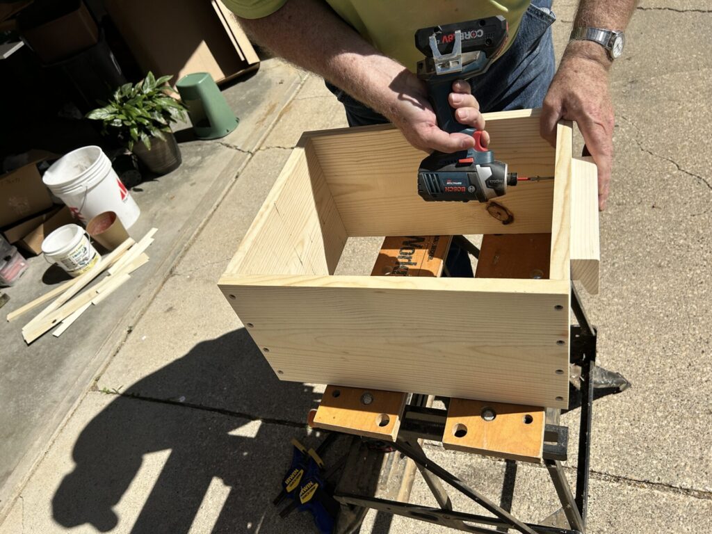 Screwing the handle on a Jenga case